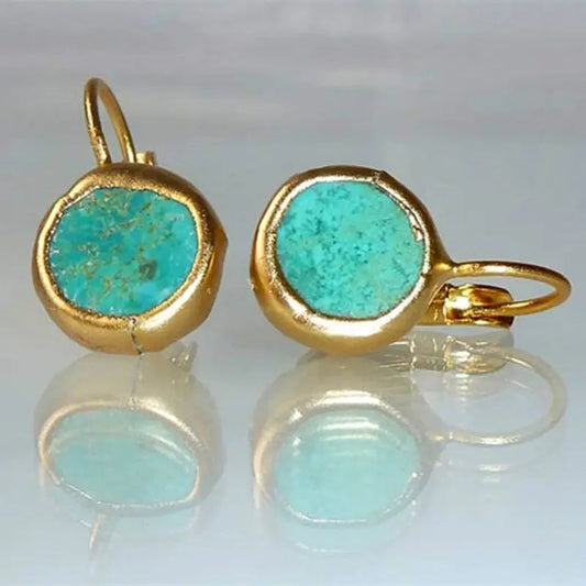 Elegante goldene Ohrringe mit Türkisstein